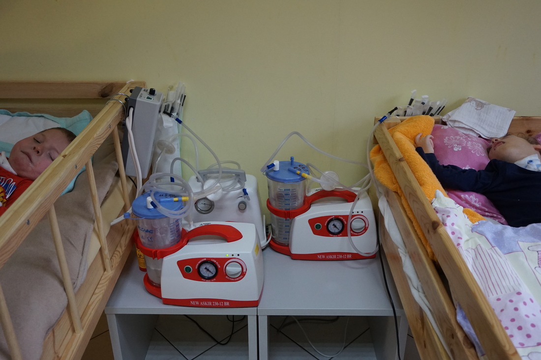 Two children under the care of the hospice using equipment donated by riders from Cycle Poland
